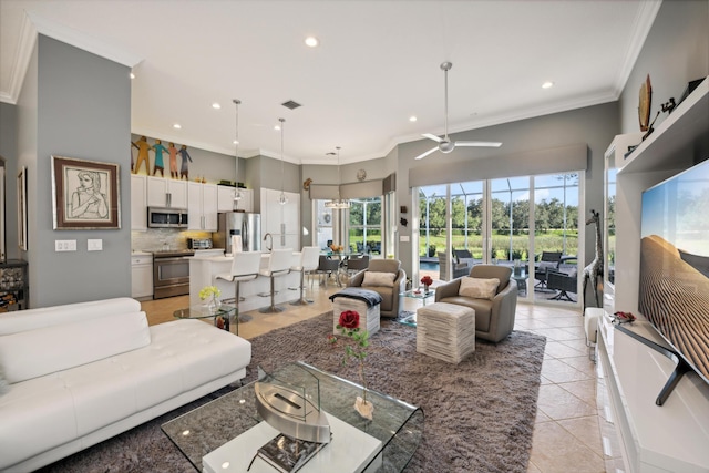 tiled living room featuring ceiling fan and crown molding