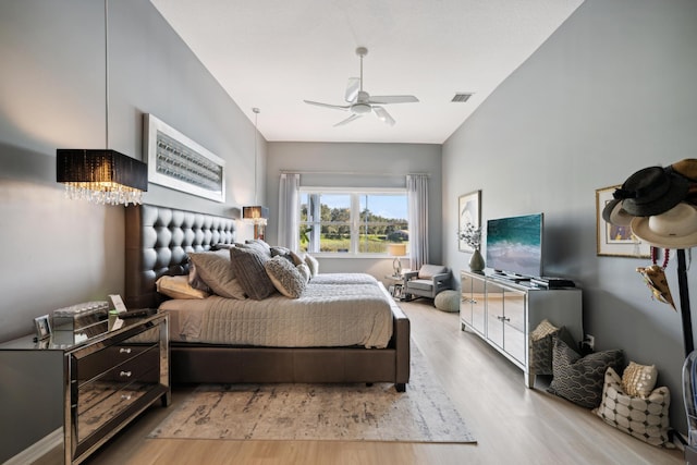 bedroom with light wood-type flooring and ceiling fan