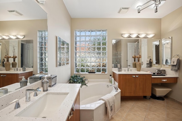 bathroom with vanity, tile patterned flooring, and independent shower and bath