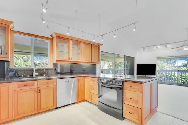 kitchen featuring range with electric stovetop, a wealth of natural light, dishwasher, and sink