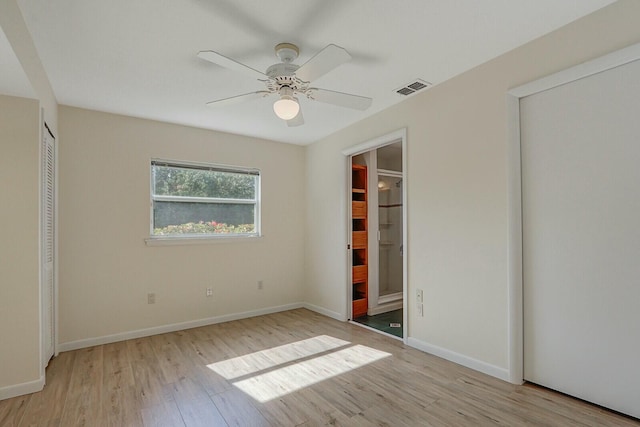 unfurnished bedroom with ceiling fan and light wood-type flooring