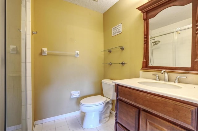 bathroom with tile patterned floors, walk in shower, vanity, a textured ceiling, and toilet