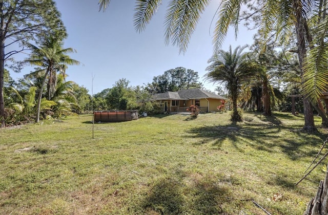 view of yard featuring a swimming pool