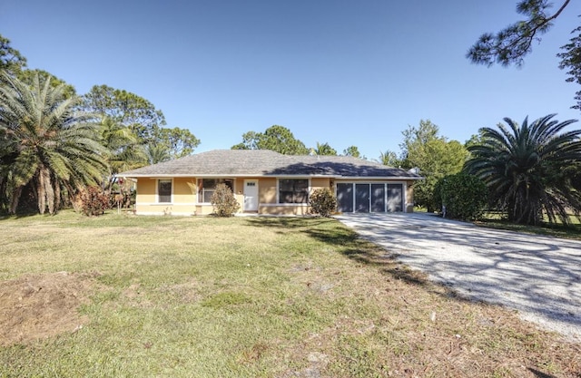 single story home featuring a front yard