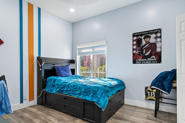 bedroom with light hardwood / wood-style floors