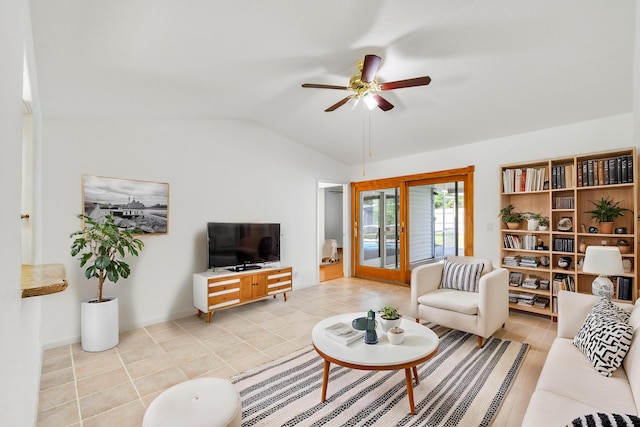 living room with french doors, light tile patterned flooring, ceiling fan, and vaulted ceiling