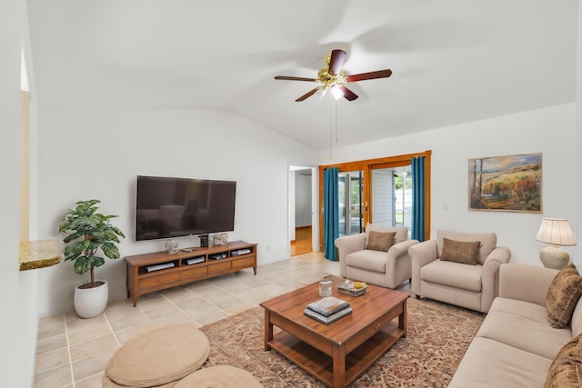 tiled living room featuring ceiling fan and vaulted ceiling