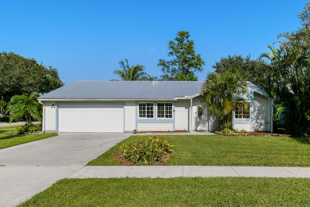 ranch-style home with a front lawn and a garage