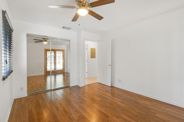 unfurnished room featuring ceiling fan and hardwood / wood-style floors