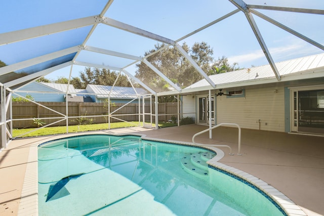 view of swimming pool featuring a patio area and a lanai