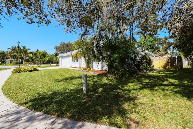 exterior space with a front lawn and a garage