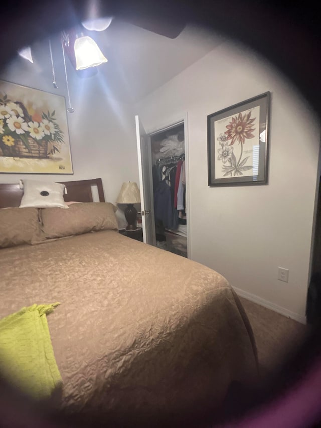 carpeted bedroom featuring a closet