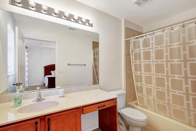 full bathroom featuring vanity, shower / bath combination with curtain, and toilet