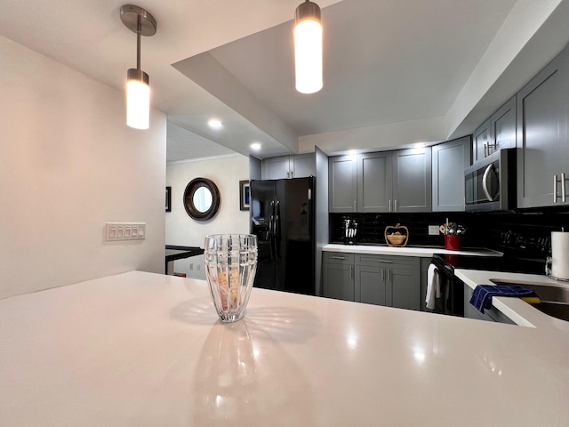 kitchen with range with electric cooktop, black refrigerator with ice dispenser, pendant lighting, gray cabinets, and decorative backsplash