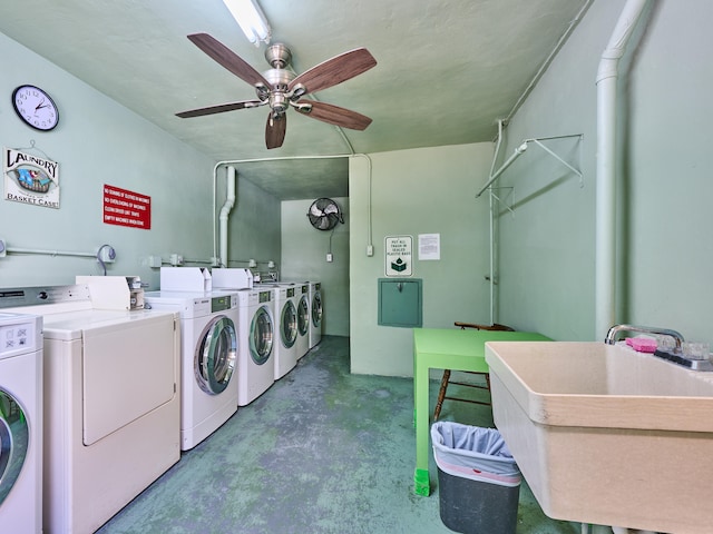 clothes washing area with separate washer and dryer, ceiling fan, and sink