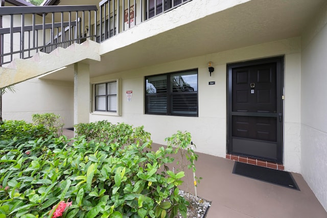 doorway to property featuring a balcony