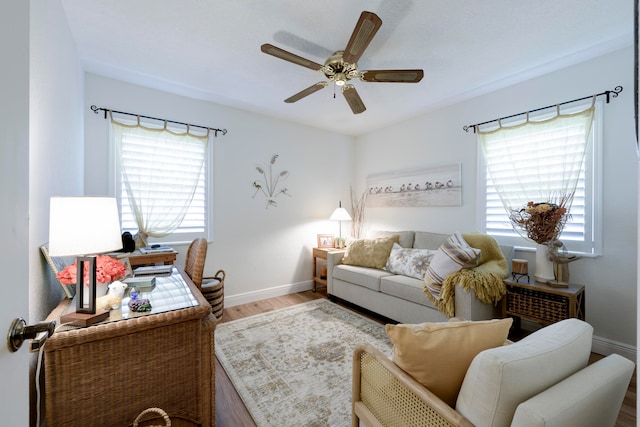 living room featuring ceiling fan and wood-type flooring