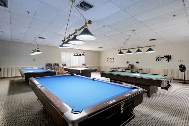 recreation room with a paneled ceiling, carpet floors, and billiards