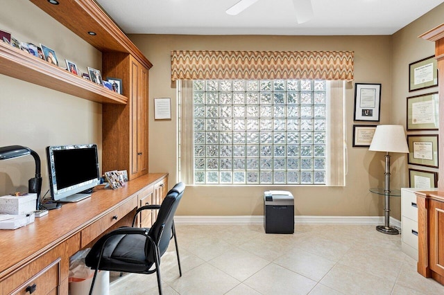 office area with ceiling fan, light tile patterned floors, and a healthy amount of sunlight