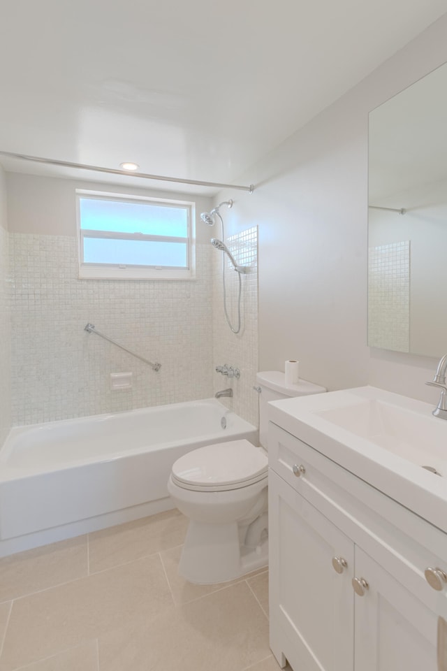 full bathroom with tile patterned floors, toilet, vanity, and tiled shower / bath