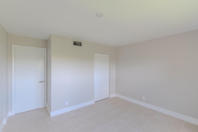 empty room with light tile patterned floors