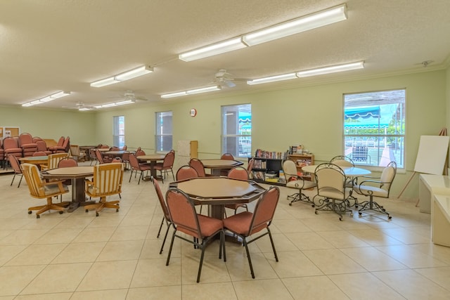 dining area featuring ceiling fan, plenty of natural light, and light tile patterned flooring