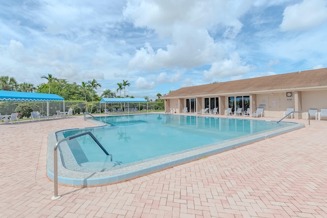 view of swimming pool featuring a patio area