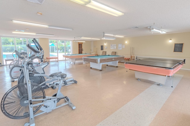 game room featuring a textured ceiling and billiards