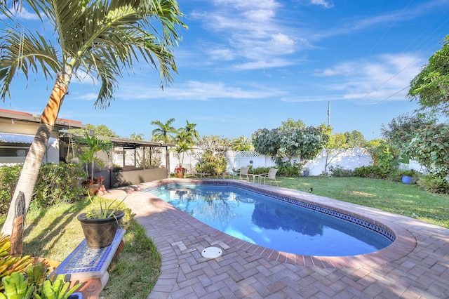 view of pool featuring a yard