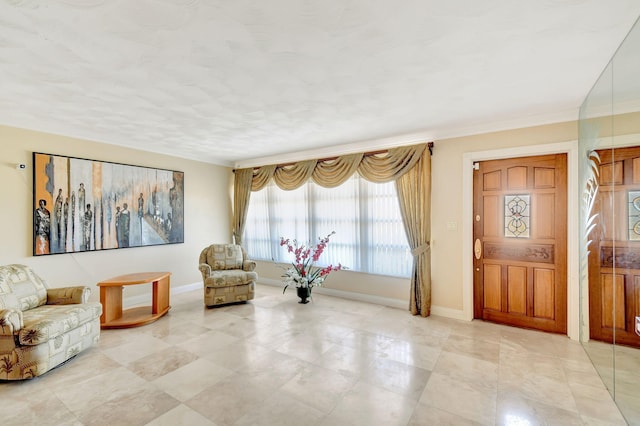 sitting room featuring crown molding