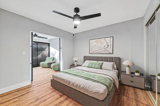 bedroom featuring ceiling fan, a closet, and light hardwood / wood-style floors