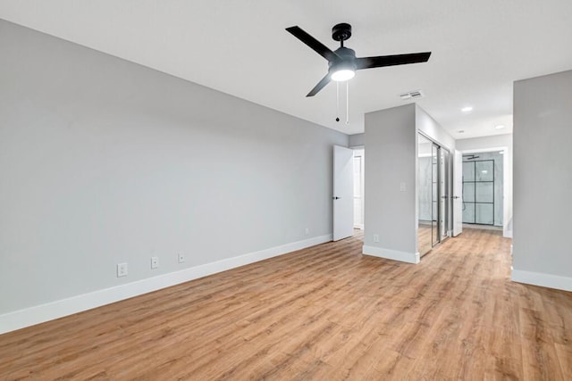 unfurnished living room with light wood-type flooring and ceiling fan