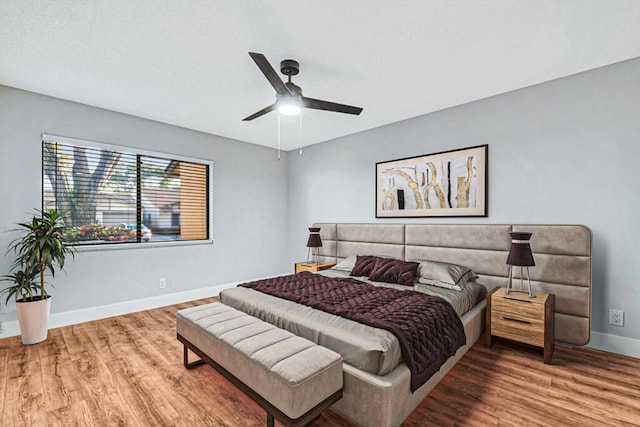 bedroom featuring wood-type flooring and ceiling fan