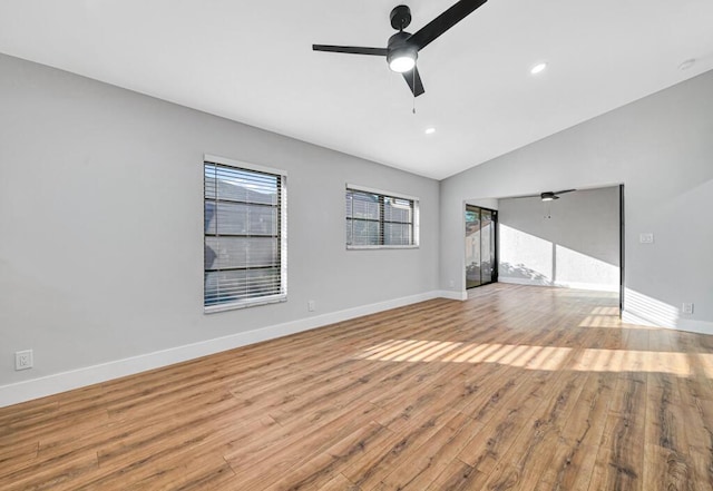 unfurnished living room with ceiling fan, light hardwood / wood-style flooring, and vaulted ceiling