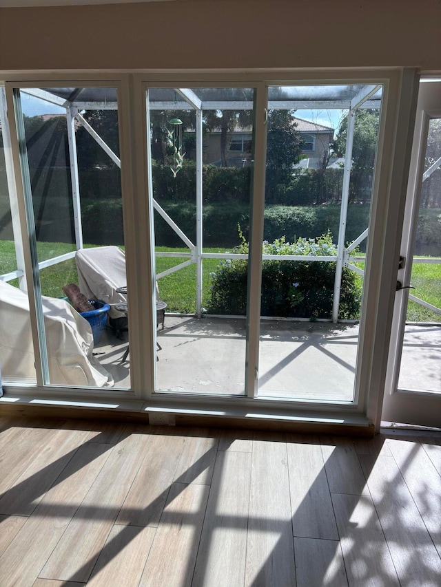 entryway with hardwood / wood-style flooring