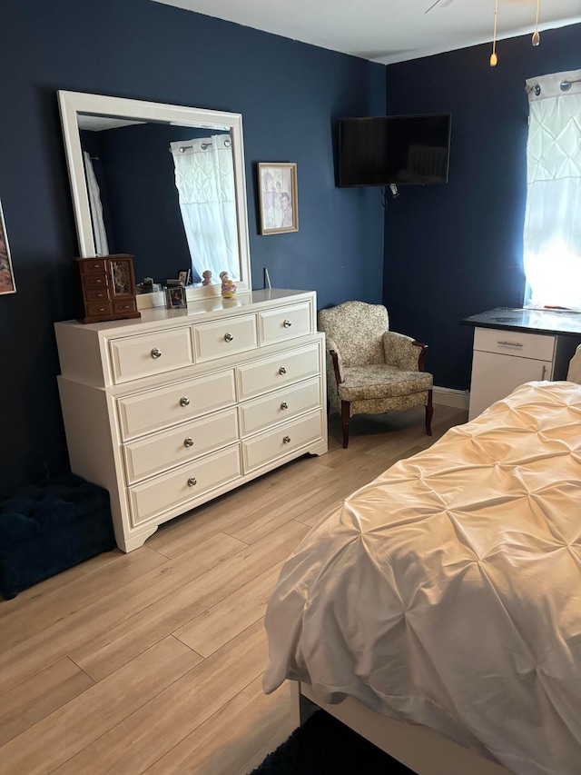 bedroom with light wood-type flooring