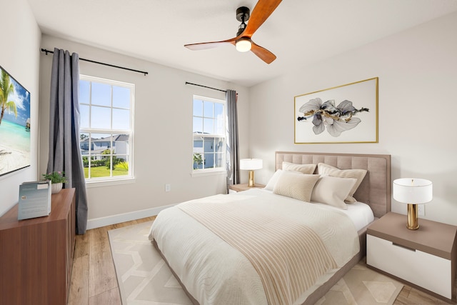 bedroom featuring ceiling fan and light hardwood / wood-style flooring