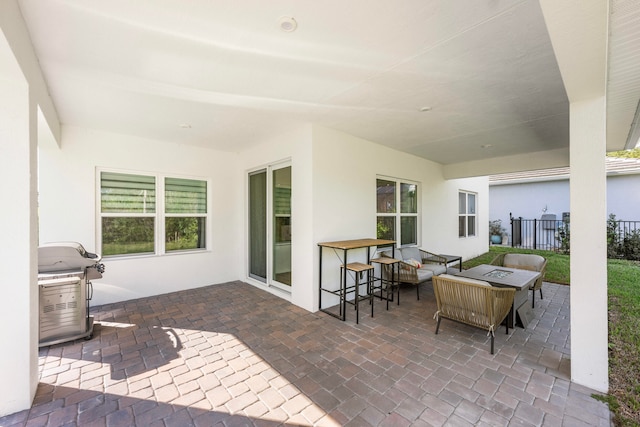 view of patio / terrace with a grill and an outdoor fire pit