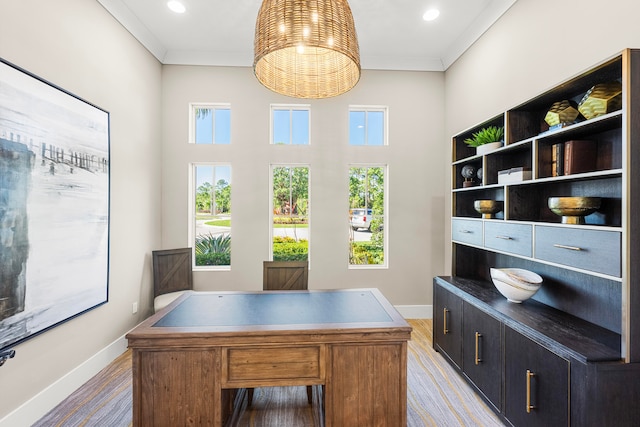 home office featuring hardwood / wood-style floors and ornamental molding