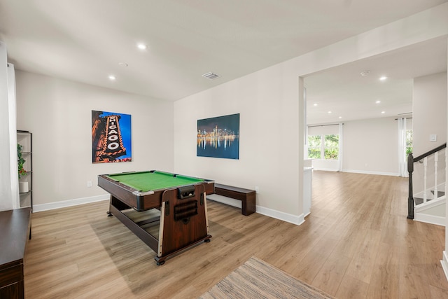 recreation room with billiards and light hardwood / wood-style flooring