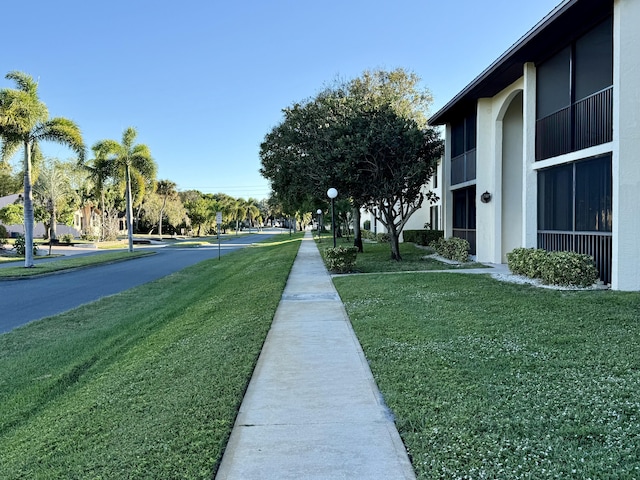 200 SE Four Winds Dr Unit 213, Stuart, FL 34996 - view of asphalt street featuring sidewalks and street lights