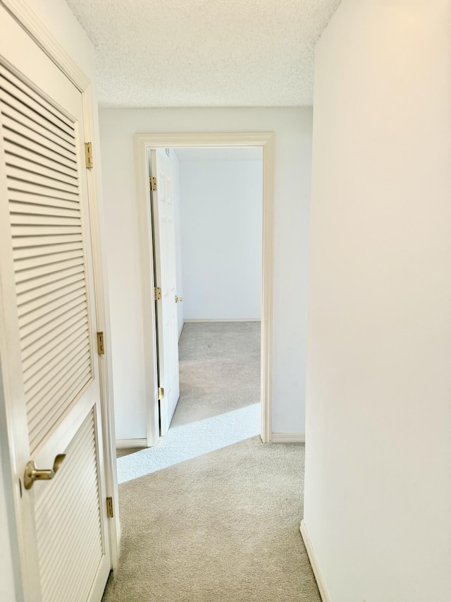 200 SE Four Winds Dr Unit 213, Stuart, FL 34996 - hall with carpet flooring and a textured ceiling