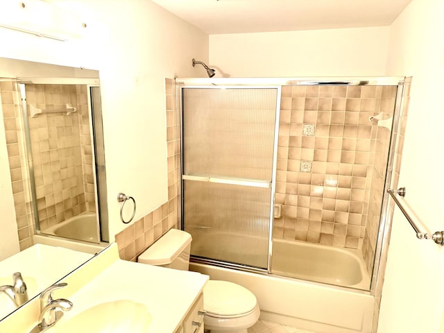 200 SE Four Winds Dr Unit 213, Stuart, FL 34996 - full bath with vanity, enclosed tub / shower combo, and tile patterned floors