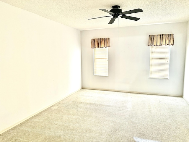 200 SE Four Winds Dr Unit 213, Stuart, FL 34996 - empty room featuring carpet floors, ceiling fan, and a textured ceiling