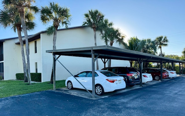 view of parking / parking lot featuring a carport