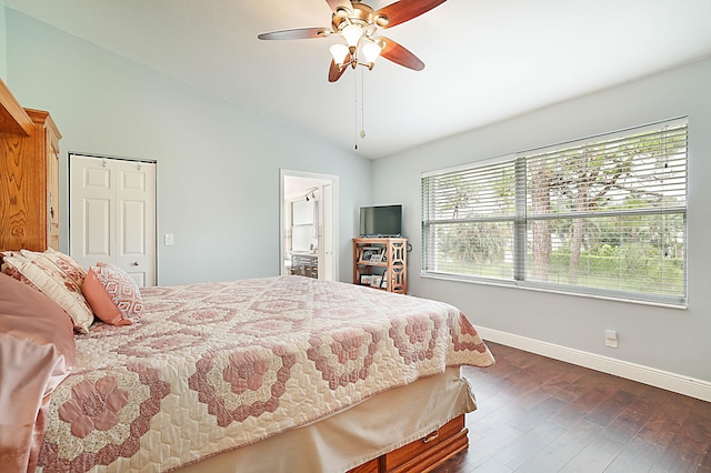 bedroom with ceiling fan, dark hardwood / wood-style floors, lofted ceiling, and a closet