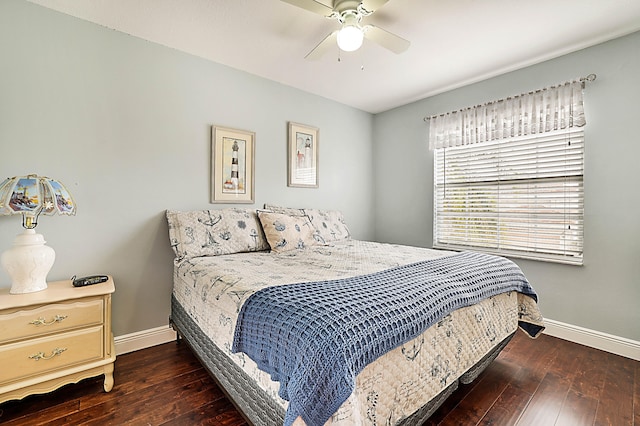 bedroom with dark hardwood / wood-style floors and ceiling fan