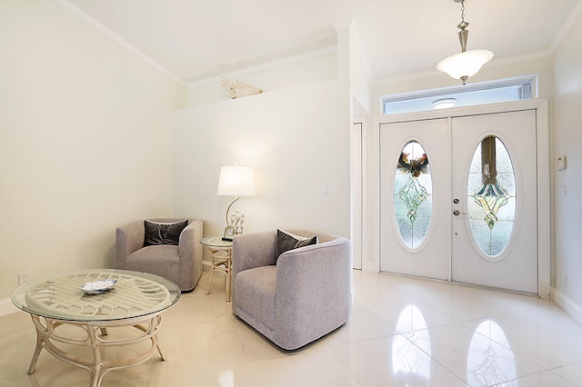 entrance foyer with french doors and crown molding