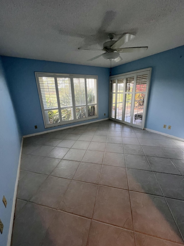 full bathroom with shower / bath combination with glass door, vanity, tile patterned floors, and toilet