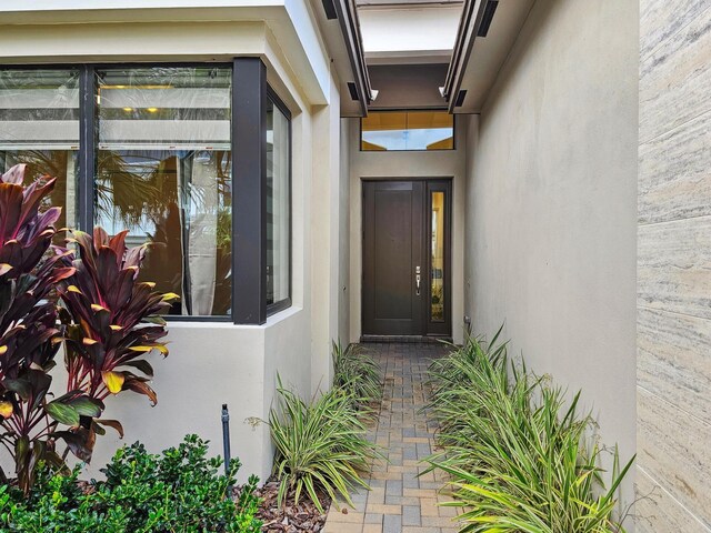 view of front of property featuring a front lawn and a garage